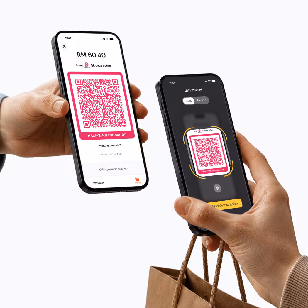 Two hands holding smartphones showing QR code payment screens with RM 60.40 amount.